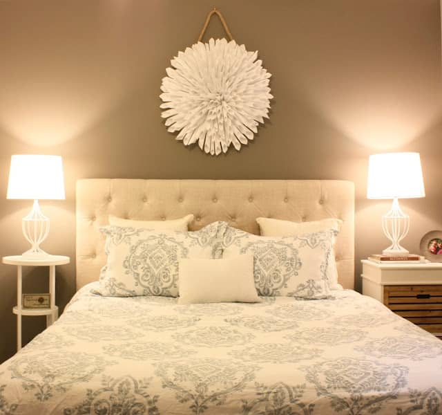 Traditional lighting and bedding help create a cozy space.