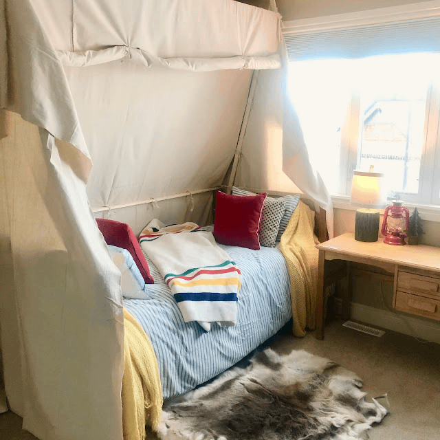 The colour palette for this outdoorsy bedroom was taken from the colourful blanket on the bed